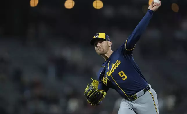 Milwaukee Brewers' Jake Bauers pitches to a San Francisco Giants batter during the eighth inning of a baseball game, Wednesday, Sept. 11, 2024, in San Francisco. (AP Photo/Godofredo A. Vásquez)