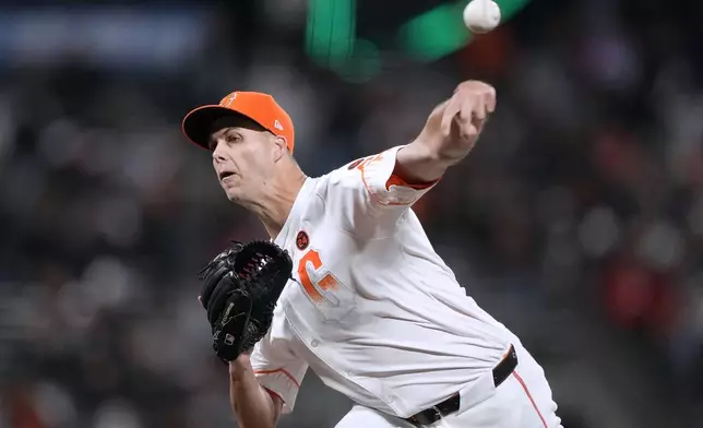 San Francisco Giants pitcher Taylor Rogers throws against the Milwaukee Brewers during the ninth inning of a baseball game Tuesday, Sept. 10, 2024, in San Francisco. (AP Photo/Tony Avelar)