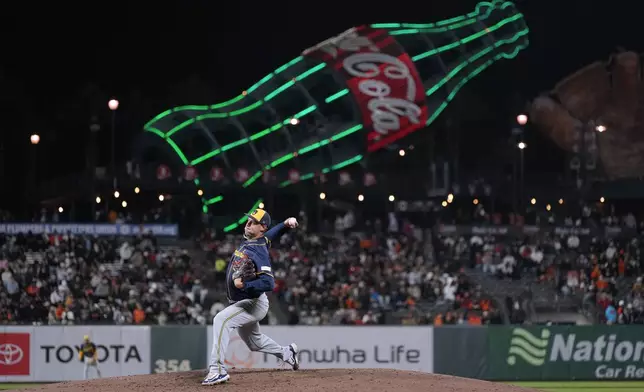 Milwaukee Brewers pitcher Trevor Megill throws against the San Francisco Giants during the eighth inning of a baseball game Tuesday, Sept. 10, 2024, in San Francisco. (AP Photo/Tony Avelar)