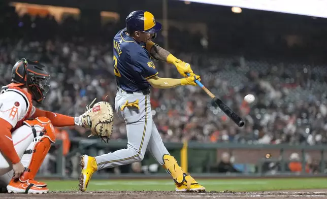 Milwaukee Brewers' Joey Ortiz hits a triple against the San Francisco Giants during the seventh inning of a baseball game Tuesday, Sept. 10, 2024, in San Francisco. (AP Photo/Tony Avelar)