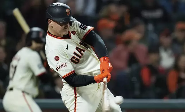 San Francisco Giants’ Matt Chapman hits a solo home run during the fourth inning of a baseball game against the Milwaukee Brewers, Wednesday, Sept. 11, 2024, in San Francisco. (AP Photo/Godofredo A. Vásquez)