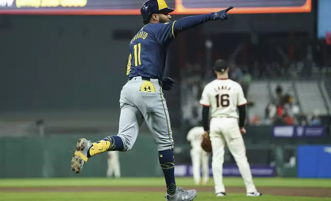 Milwaukee Brewers' Jackson Chourio, left, celebrates after hitting a two-run home run during the eighth inning of a baseball game against the San Francisco Giants, Thursday, Sept. 12, 2024. (AP Photo/Kavin Mistry)