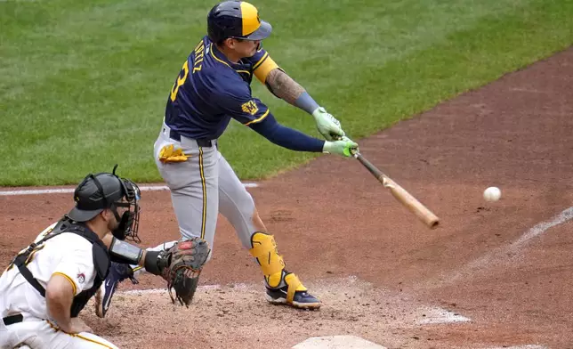 Milwaukee Brewers' Joey Ortiz (3) doubles off Pittsburgh Pirates relief pitcher Colin Holderman, driving in a run, during the sixth inning of a baseball game in Pittsburgh, Thursday, Sept. 26, 2024. (AP Photo/Gene J. Puskar)