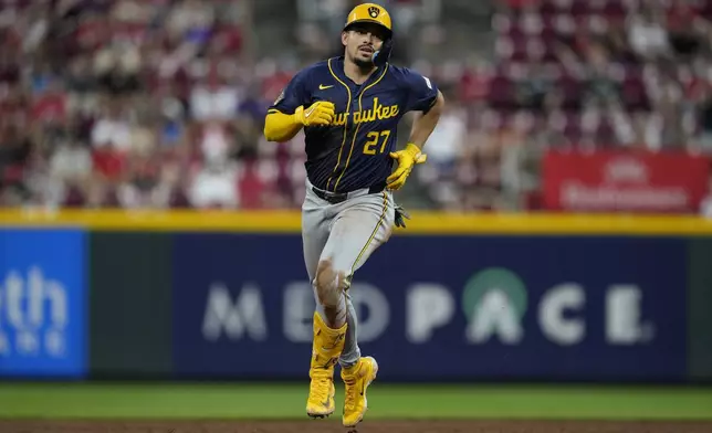 Milwaukee Brewers' Willy Adames rounds the bases after hitting a three-run home run during the third inning of a baseball game against the Cincinnati Reds, Saturday, Aug. 31, 2024, in Cincinnati. (AP Photo/Carolyn Kaster)