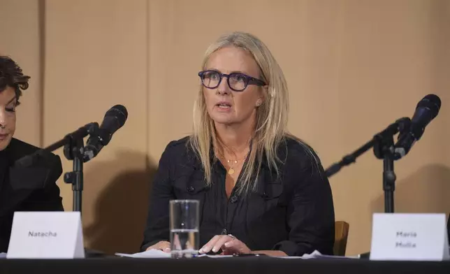 One of Mr Al Fayed's accusers, Natacha (no surname given), who featured in 'Al-Fayed: Predator at Harrods' speaks during a press conference to discuss their involvement in the investigation and the legal claim against Harrods for failing to provide a safe system of work for their employees, at Kent House in Knightsbridge, London, Friday Sept. 20, 2024. Multiple ex-Harrods employees have accused Mohamed Al Fayed, the Egyptian billionaire who owned the luxury department store for more than 25 years, of rape and sexual assault. (Yui Mok/PA via AP)