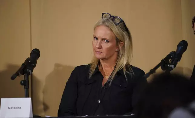 One of Mr Al Fayed's accusers, Natacha (no surname given), who featured in 'Al-Fayed: Predator at Harrods', looks on during a press conference to discuss their involvement in the investigation and the legal claim against Harrods for failing to provide a safe system of work for their employees, at Kent House in Knightsbridge, London, Friday Sept. 20, 2024. Multiple ex-Harrods employees have accused Mohamed Al Fayed, the Egyptian billionaire who owned the luxury department store for more than 25 years, of rape and sexual assault. (Yui Mok/PA via AP)