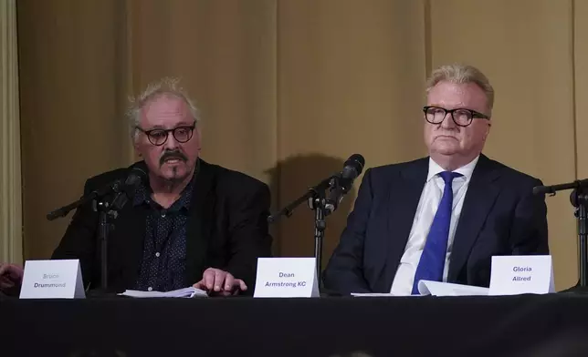 Members of the legal team, barrister Bruce Drummond, left, and Dean Armstrong KC, who featured in 'Al-Fayed: Predator at Harrods', hold a press conference to discuss their involvement in the investigation and the legal claim against Harrods for failing to provide a safe system of work for their employees, at Kent House in Knightsbridge, London, Friday Sept. 20, 2024. Multiple ex-Harrods employees have accused Mohamed Al Fayed, the Egyptian billionaire who owned the luxury department store for more than 25 years, of rape and sexual assault. (Yui Mok/PA via AP)