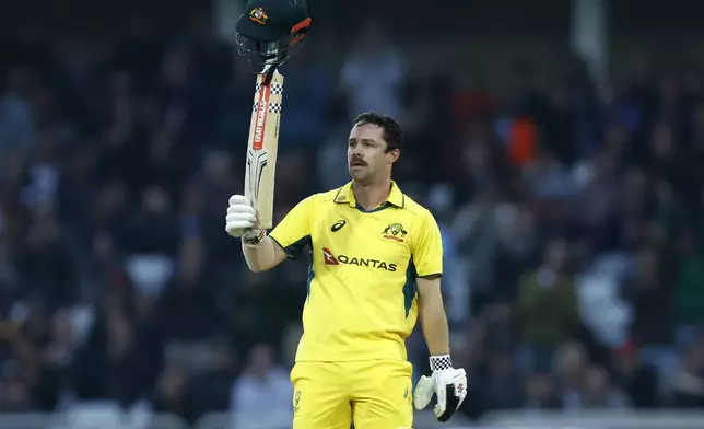 Australia's Travis Head celebrates 100 runs during the first one day international match between England and Australia, at Trent Bridge, Nottingham, England, Thursday Sept. 19, 2024. (Nigel French/PA via AP)