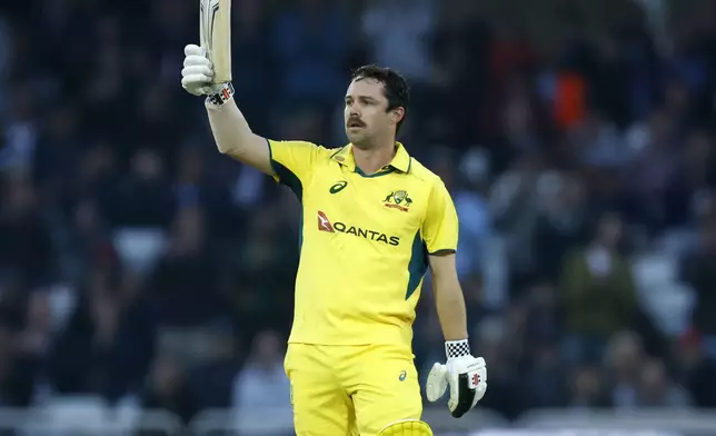 Australia's Travis Head celebrates 100 runs during the first one day international match between England and Australia, at Trent Bridge, Nottingham, England, Thursday Sept. 19, 2024. (Nigel French/PA via AP)