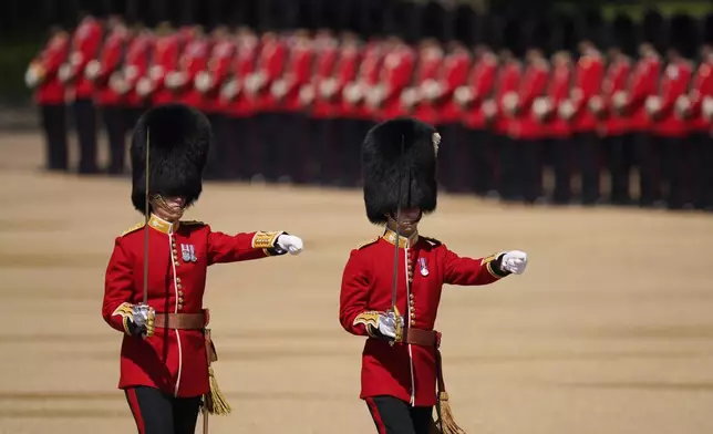 FILE - Soldiers attend the Colonel's Review, the final rehearsal of the Trooping the Colour, the King's annual birthday parade, at Horse Guards Parade in London, Saturday, June 10, 2023. (AP Photo/Alberto Pezzali, File)