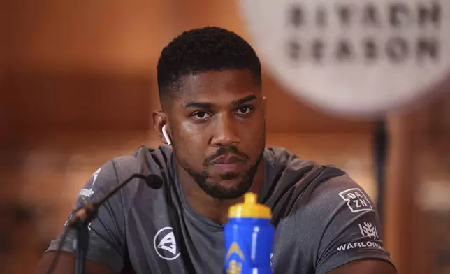 Anthony Joshua looks on during a press conference at the Guildhall, London, Thursday Sept. 19, 2024. The IBF heavyweight title fight between Anthony Joshua and Daniel Dubois will take place on Saturday 21st September. (Bradley Collyer/PA via AP)