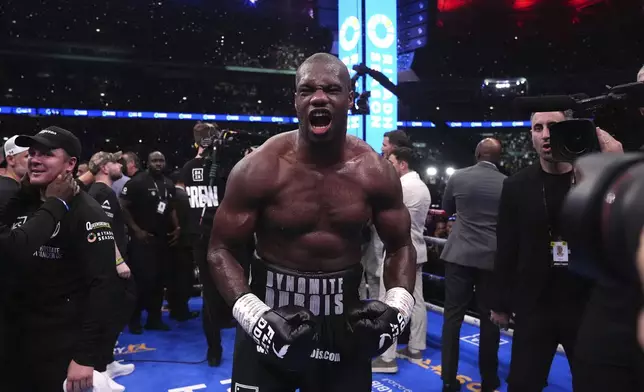 Daniel Dubois celebrates victory against Anthony Joshua, not pictured, in the IBF World Heavyweight bout at Wembley Stadium, in London, Saturday, Sept. 21, 2024. (Bradley Collyer/PA via AP)