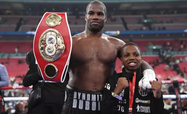 Daniel Dubois celebrates victory against Anthony Joshua, not pictured, in the IBF World Heavyweight bout at Wembley Stadium, in London, Saturday, Sept. 21, 2024. (Bradley Collyer/PA via AP)