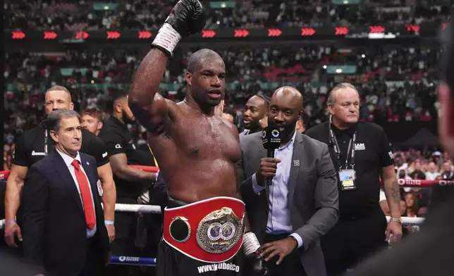 Daniel Dubois celebrates victory against Anthony Joshua, not pictured, in the IBF World Heavyweight bout at Wembley Stadium, in London, Saturday, Sept. 21, 2024. (Bradley Collyer/PA via AP)