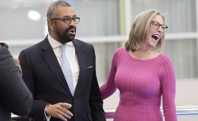 Former British Foreign Secretary James Cleverly, left, and his wife Susie are seen after appearing on the Sunday Morning with Trevor Phillips show ahead of the Conservatives annual conference where a new leader will be chosen, in Birmingham, England, Sunday, Sept. 29, 2024. (Stefan Rousseau/PA via AP)