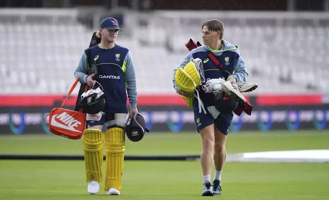 Australia's Jake Fraser-McGurk and Cooper Connolly, right, attend a nets session at Lord's Cricket Ground, London, Thursday Sept. 26, 2024. (Bradley Collyer/PA via AP)