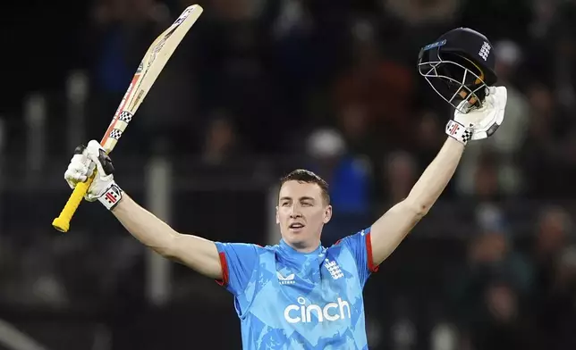 England's Harry Brook celebrates 100 runs during the third day international match at the Seat Unique Riverside, Chester-le-Street, County Durham, England, Tuesday, Sept. 24, 2024. (Owen Humphreys/PA via AP)