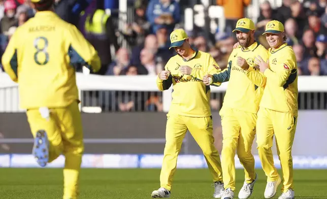 Australia's Glenn Maxwell, centre left, celebrates with teammates after catching out England's Ben Duckett during the third day of international match at the Seat Unique Riverside, Chester-le-Street, County Durham, England, Tuesday, Sept. 24, 2024. (Owen Humphreys/PA via AP)