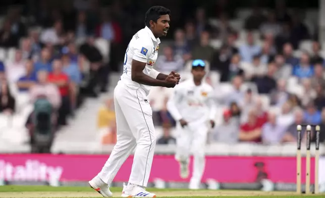 Sri Lanka's Vishwa Fernando celebrates taking the wicket of England's Jamie Smith during day two of the Third Rothesay Men's Test match between England and Sri Lanka in London, England, Saturday, Sept. 7, 2024. (John Walton/PA via AP)