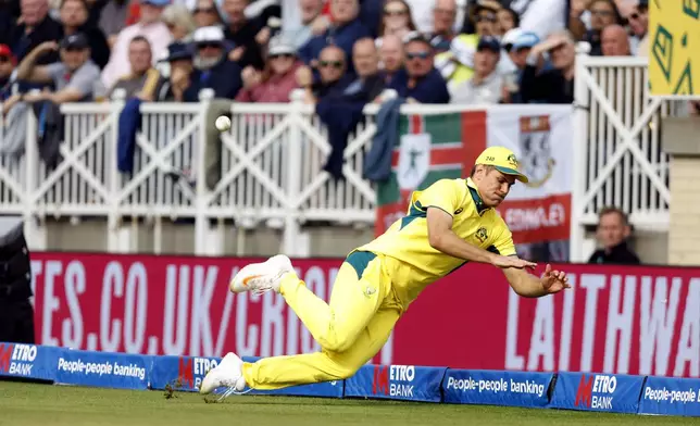 Australia's Aaron Hardie prevents a boundary as he fields during the first one day international match at Trent Bridge, Nottingham, England, Thursday, Sept. 19, 2024. (Nigel French/PA via AP)