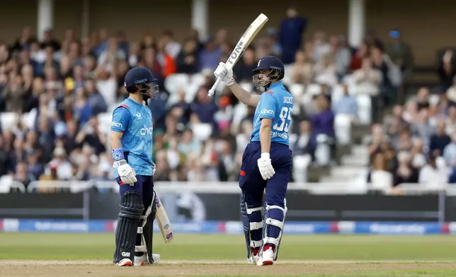 England's Will Jacks celebrates reaching his half century as he bats during the first one day international match at Trent Bridge, Nottingham, England, Thursday, Sept. 19, 2024. (Nigel French/PA via AP)