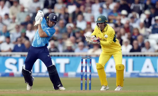 England's Jacob Bethell, left, bats during the first one day international match at Trent Bridge, Nottingham, England, Thursday, Sept. 19, 2024. (Nigel French/PA via AP)