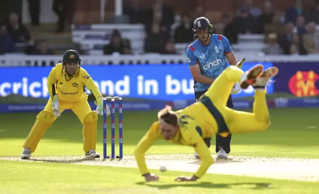 Australia's Marnus Labuschagne attempts to catch England's Jamie Smith during the fourth One Day International match between England and Australia at Lord's Cricket Ground, London, Friday Sept. 27, 2024. (John Walton/PA via AP)