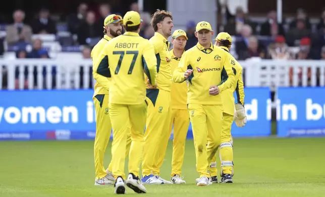 Australia's Mitchell Marsh, center, celebrates the wicket of England's Will Jacks with teammates during the fourth One Day International match between England and Australia at Lord's Cricket Ground, London, Friday Sept. 27, 2024. (John Walton/PA via AP)