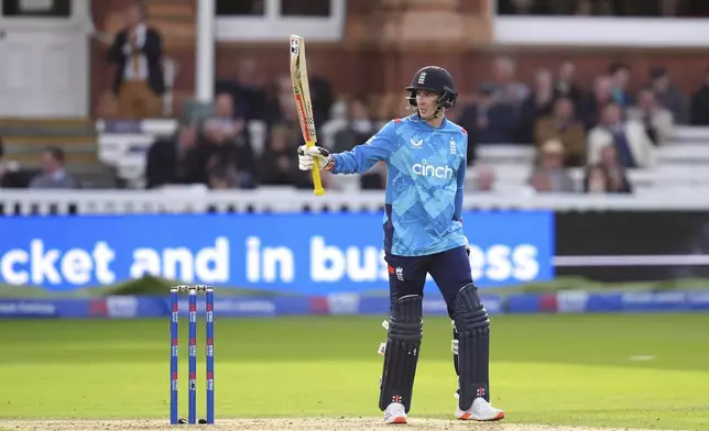 England's Harry Brook celebrates 50 runs during the fourth One Day International match between England and Australia at Lord's Cricket Ground, London, Friday Sept. 27, 2024. (John Walton/PA via AP)