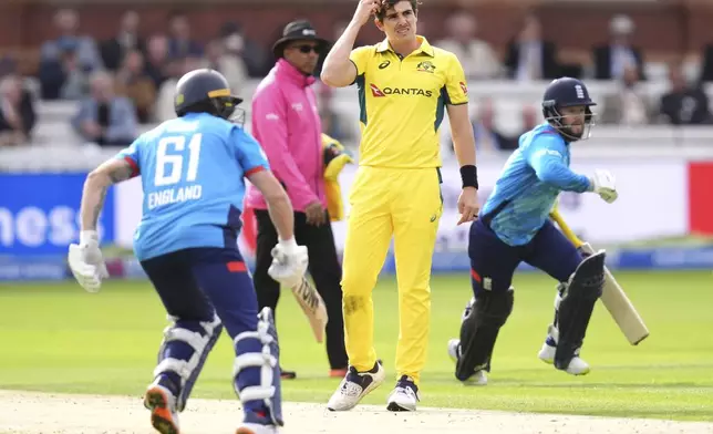 Australia's Sean Abbott, center, reacts as England's Phil Salt, left, and Ben Duckett claim a run during the fourth One Day International match between England and Australia at Lord's Cricket Ground, London, Friday Sept. 27, 2024. (John Walton/PA via AP)