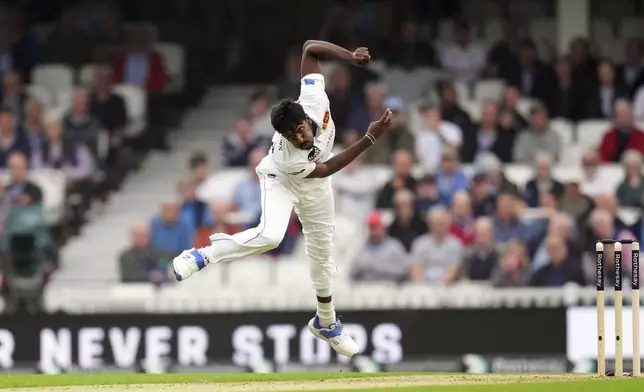 Sri Lanka's Milan Rathnayake bowls on day one of the Third Rothesay Men's Test match between England and Sri Lanka at The Kia Oval, in London, Friday Sept. 6, 2024. (John Walton/PA via AP)