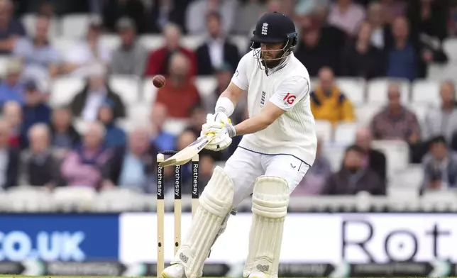 England's Ben Duckett hits the ball to Sri Lanka's Dinesh Chandimal to be caught during day one of the Third Men's Test between England and Sri Lanka at The Oval, London, Friday Sept. 6, 2024. (John Walton/PA via AP)