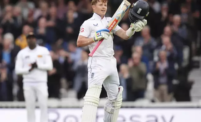 England's Ollie Pope celebrates reaching his century during day one of the Third Men's Test between England and Sri Lanka at The Oval, London, Friday Sept. 6, 2024. (John Walton/PA via AP)