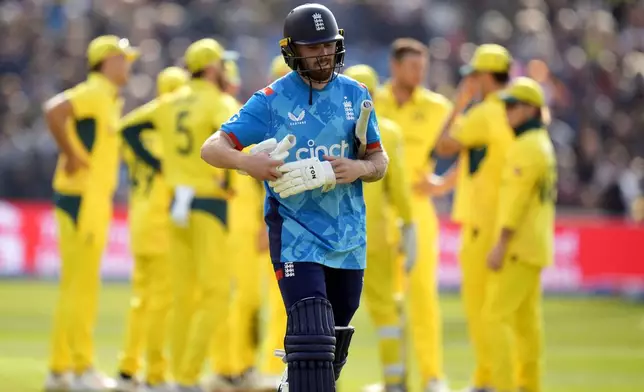 England's Phil Salt walks off the pitch after losing his wicket during the second One Day international match between England and Australia at Headingley, Leeds, Saturday Sept. 21, 2024. (Danny Lawson/PA via AP)