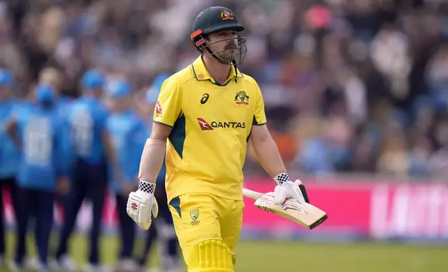 Australia's Travis Head walks off the pitch after losing his wicket during the second One Day international match between England and Australia at Headingley, Leeds, Saturday Sept. 21, 2024. (Danny Lawson/PA via AP)