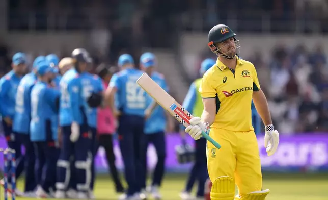 Australia's Mitchell Marsh walks off the pitch after losing his wicket during the second One Day international match between England and Australia at Headingley, Leeds, Saturday Sept. 21, 2024. (Danny Lawson/PA via AP)