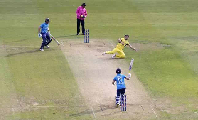 Australia's Aaron Hardie take the catch to dismiss England's Ben Duckett caught and bowled during the second One Day international match between England and Australia at Headingley, Leeds, Saturday Sept. 21, 2024. (Danny Lawson/PA via AP)