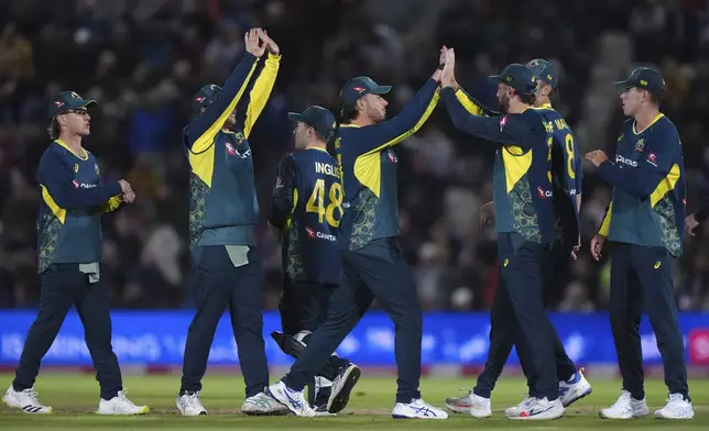 Australia's Matt Short, third right, celebrates catching out England's Phil Salt during the first IT20 cricket match between England and Australia in Southampton, England, Wednesday, Sept. 11, 2024. (Bradley Collyer/PA via AP)