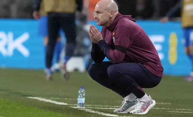 England interim manager Lee Carsley reacts during the Group F UEFA Nations League soccer match between England and Finland at Wembley Stadium in London, Tuesday, Sept. 10, 2024. (AP Photo/Frank Augstein)