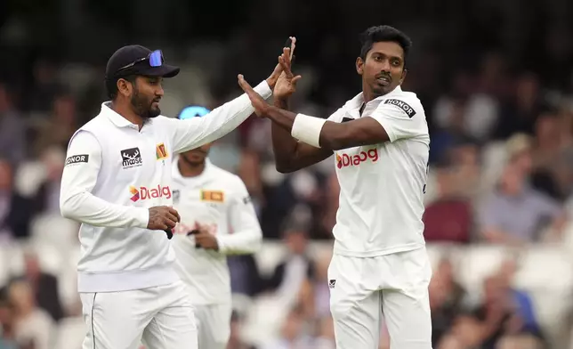 Sri Lanka's Vishwa Fernando celebrates taking the wicket of England's Jamie Smith during day two of the Third Rothesay Men's Test match at The Kia Oval, London, Saturday Sept. 7, 2024. (John Walton/PA via AP)