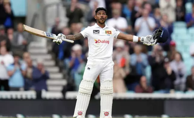 Sri Lanka's Pathum Nissanka celebrates reaching his century on day four of the Third Rothesay Men's Test at The Kia Oval, in London, Monday Sept. 9, 2024. (John Walton/PA via AP)