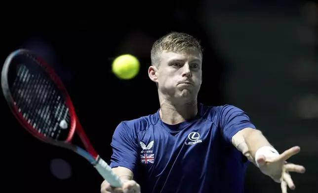 Britain's Billy Harris returns the ball to Finland's Otto Virtanen during the Davis Cup group stage finals match at the AO Arena, in Manchester, England, Wednesday, Sept. 11, 2024. (Martin Rickett/PA via AP)