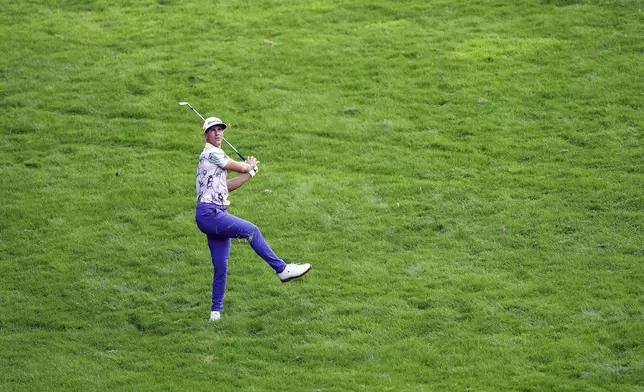 Denmark's Thorbjorn Olesen plays from the 1st fairway during day two of the 2024 BMW PGA Championship at Wentworth Golf Club in Virginia Water, England, Friday Sept. 20, 2024. (Zac Goodwin/PA via AP)