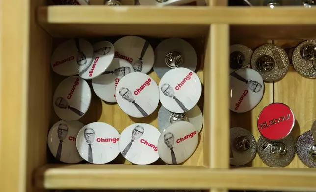 Pins for sale are on display in a drawer at the Labour Party Conference in Liverpool, England, Monday, Sept. 23, 2024.(AP Photo/Jon Super)