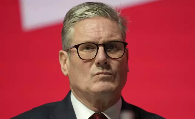 Britain's Prime Minister Keir Starmer listens to the speech of Britain's Chancellor of the Exchequer Rachel Reeves at the Labour Party Conference in Liverpool, England, Monday, Sept. 23, 2024.(AP Photo/Jon Super)