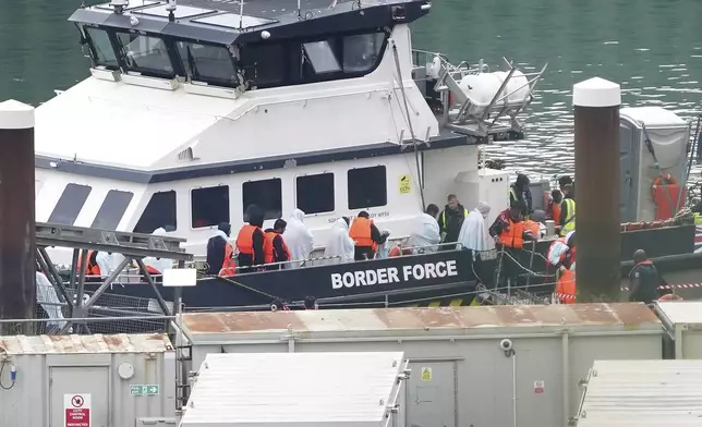 A group of people thought to be migrants are brought in to Dover, Kent, from a Border Force vessel following a small boat incident in the Channel, Wednesday Sept. 4, 2024. (Gareth Fuller/PA via AP)