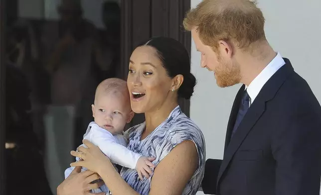 FILE - Britain's Prince Harry and Meghan, Duchess of Sussex, holding their son Archie, meet with Anglican Archbishop Emeritus, Desmond Tutu, and his wife Leah in Cape Town, South Africa, Wednesday, Sept. 25, 2019. (Henk Kruger/Pool via AP, Pool, File)