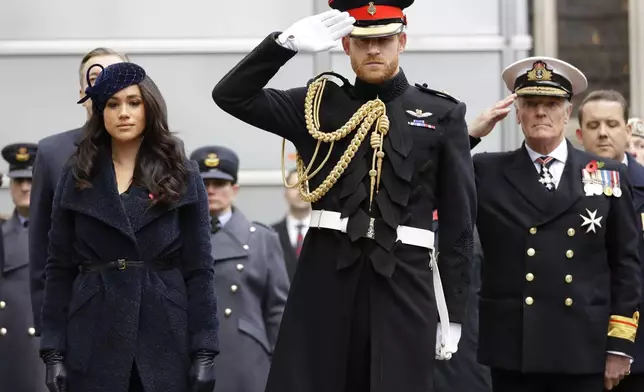 FILE - Britain's Prince Harry and Meghan, the Duchess of Sussex attend the 91st Field of Remembrance at Westminster Abbey in London, Thursday, Nov. 7, 2019. (AP Photo/Kirsty Wigglesworth, File)