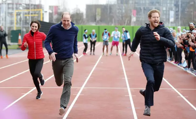 FILE - Britain's Prince William, second left, Kate, the Duchess of Cambridge, left, and Prince Harry take part in a relay race, during a training event to promote the charity Heads Together, at the Queen Elizabeth II Park in London, Sunday, Feb. 5, 2017. (AP Photo/Alastair Grant, Pool, File)