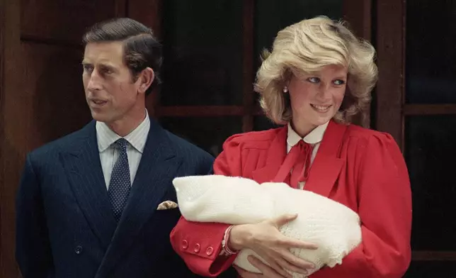 FILE - The Prince and Princess of Wales, Prince Charles and Princess Diana leave St. Mary's Hospital in Paddington, London on Sept. 16, 1984 with their new baby son, Prince Harry who was born on Sept. 15. (AP Photo, File)